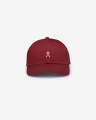 Gorra ICON COLOR de Harper & Neyer en burdeos, vista frontal con bordado del casco y los mazos en camel