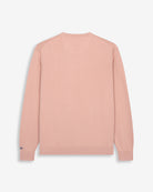 Jersey ICON COLORS en algodón rosa empolvado de Harper & Neyer, bodegón trasero con firma Neyer en el puño