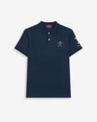 Polo WINNER de Harper & Neyer en algodón azul marino, bodegón frontal con número uno camel en la manga